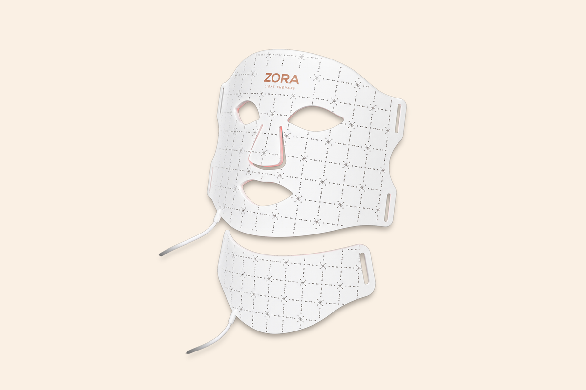Zora LED lichttherapiemasker met nekstuk, vooraanzicht op beige achtergrond